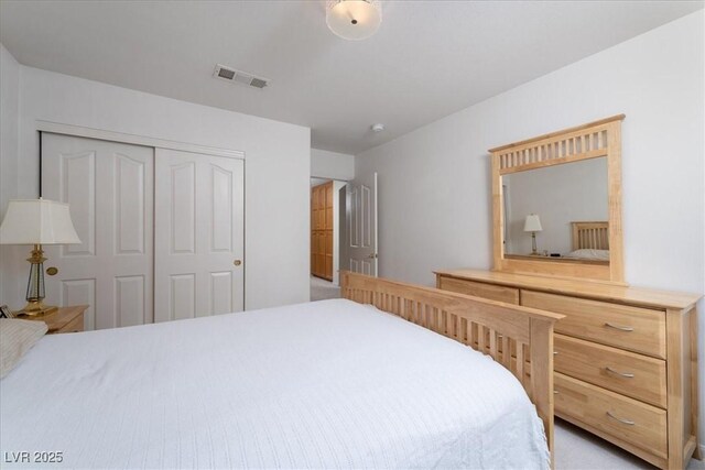 bedroom featuring a closet and visible vents