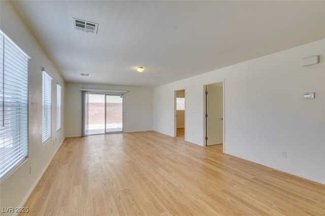 11668 Tierney Creek Dr, Las Vegas, NV 89183 - empty room with light wood-type flooring and baseboards