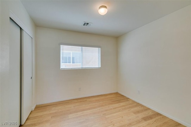 11668 Tierney Creek Dr, Las Vegas, NV 89183 - unfurnished bedroom featuring light wood finished floors, a closet, and baseboards