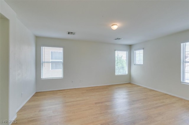 11668 Tierney Creek Dr, Las Vegas, NV 89183 - unfurnished room with light wood-style flooring and baseboards