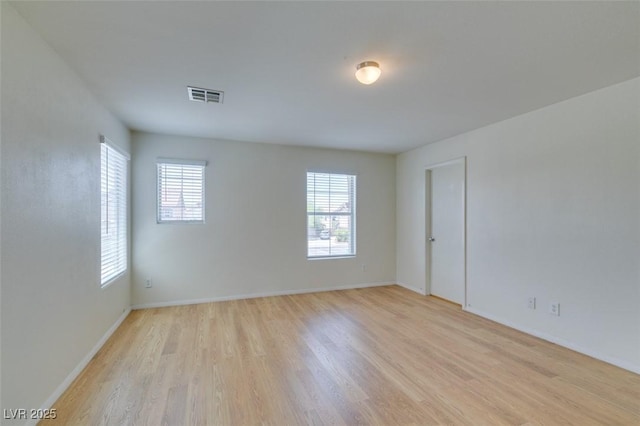 11668 Tierney Creek Dr, Las Vegas, NV 89183 - empty room with light wood-style floors and baseboards