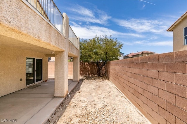 11668 Tierney Creek Dr, Las Vegas, NV 89183 - fenced backyard featuring a patio area