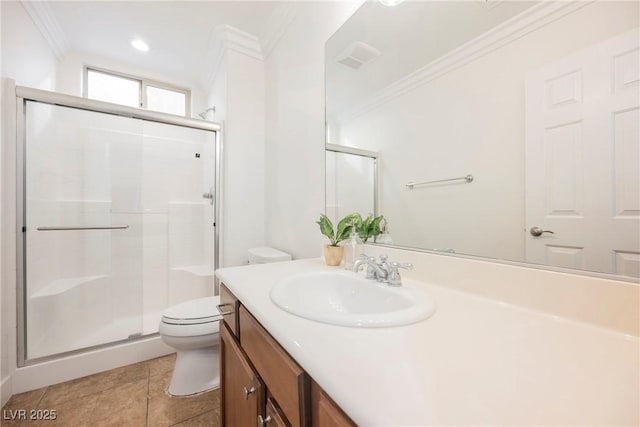 full bath featuring tile patterned flooring, toilet, vanity, crown molding, and a stall shower