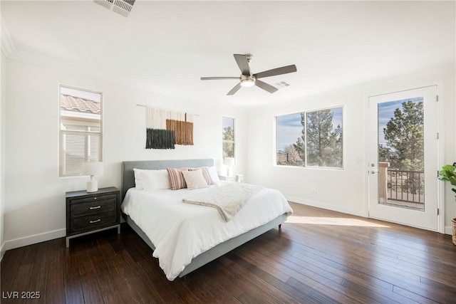 bedroom with multiple windows, visible vents, and access to exterior