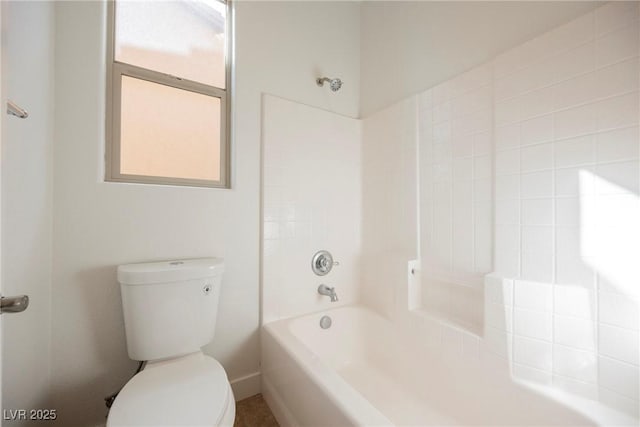 full bath with washtub / shower combination and toilet