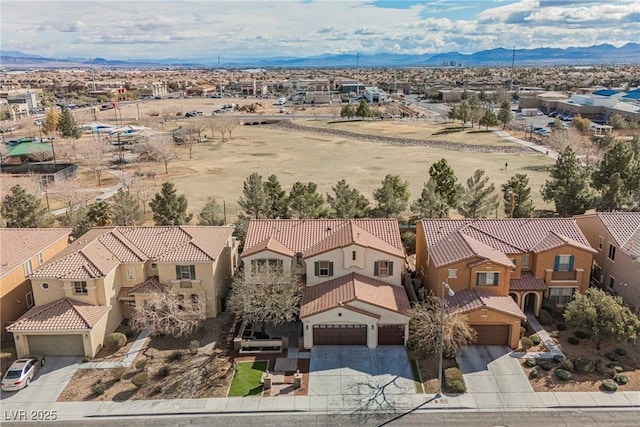 birds eye view of property featuring a mountain view and a residential view