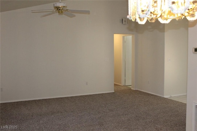 carpeted spare room with visible vents, baseboards, and ceiling fan with notable chandelier
