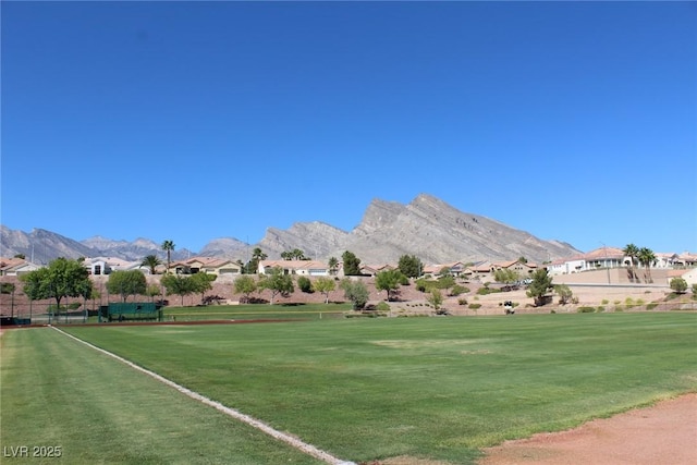 surrounding community featuring a yard, a residential view, and a mountain view