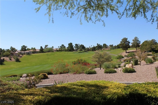 view of home's community featuring a yard and golf course view