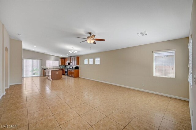 7822 Whitlocks Mill Ave, Las Vegas, NV 89147 - unfurnished living room featuring plenty of natural light, ceiling fan, and light tile patterned floors