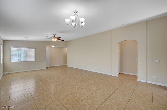 7822 Whitlocks Mill Ave, Las Vegas, NV 89147 - unfurnished room featuring arched walkways, ceiling fan, light tile patterned flooring, and a chandelier
