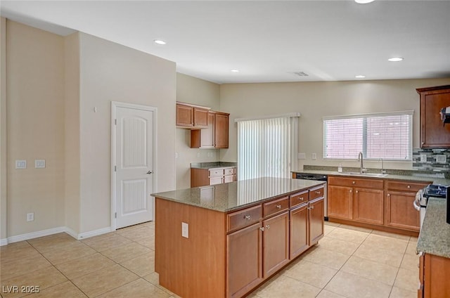 7822 Whitlocks Mill Ave, Las Vegas, NV 89147 - kitchen featuring a sink, light tile patterned floors, a center island, stone counters, and recessed lighting