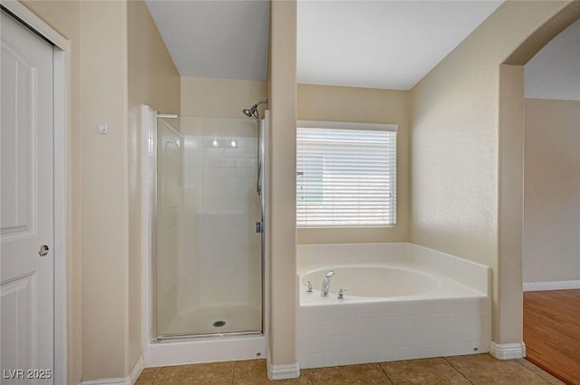 7822 Whitlocks Mill Ave, Las Vegas, NV 89147 - full bathroom with a stall shower, a bath, tile patterned flooring, and baseboards