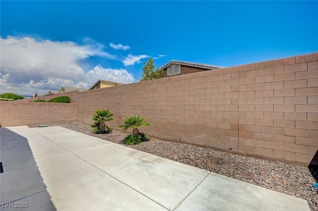 7822 Whitlocks Mill Ave, Las Vegas, NV 89147 - fenced backyard with a patio