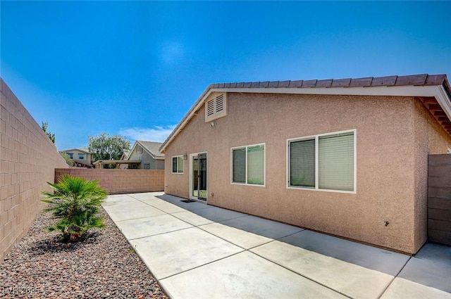 7822 Whitlocks Mill Ave, Las Vegas, NV 89147 - rear view of property featuring stucco siding and a patio