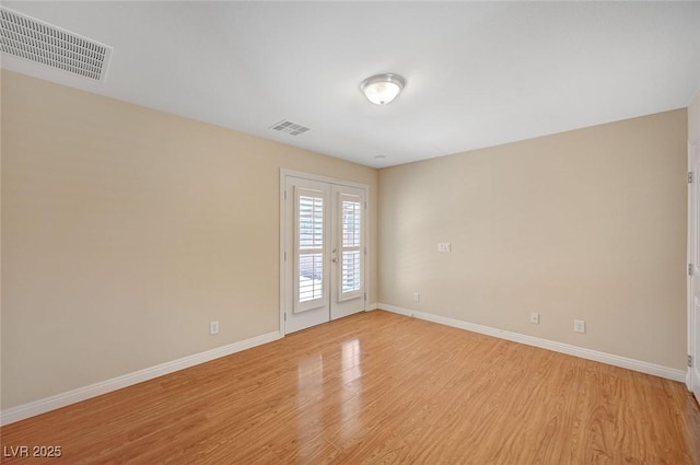 7822 Whitlocks Mill Ave, Las Vegas, NV 89147 - spare room featuring light wood-style floors, baseboards, and french doors