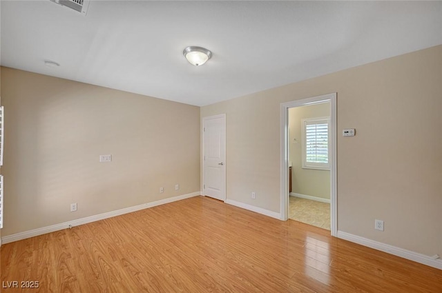 7822 Whitlocks Mill Ave, Las Vegas, NV 89147 - spare room featuring light wood-style floors and baseboards