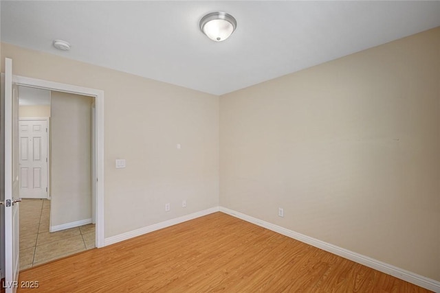 7822 Whitlocks Mill Ave, Las Vegas, NV 89147 - unfurnished room with baseboards, light wood-type flooring, and a smoke detector