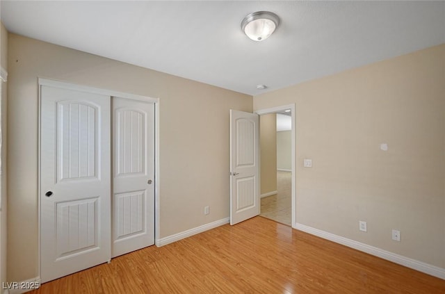 7822 Whitlocks Mill Ave, Las Vegas, NV 89147 - unfurnished bedroom with light wood-type flooring, a closet, and baseboards