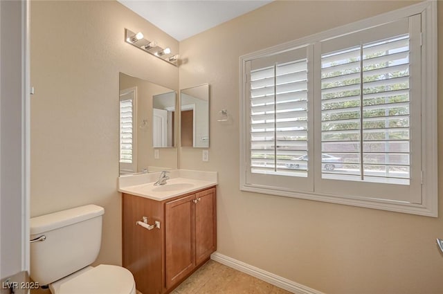 7822 Whitlocks Mill Ave, Las Vegas, NV 89147 - half bathroom with vanity, toilet, baseboards, and tile patterned flooring
