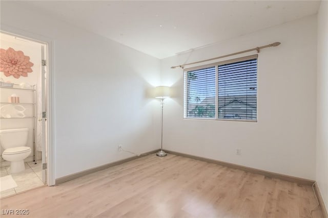 805 Blue Springs Dr, Henderson, NV 89002 - spare room with baseboards and light wood-style flooring