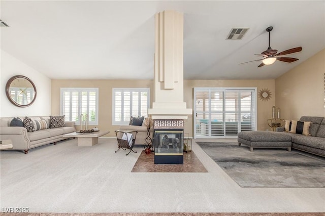 805 Blue Springs Dr, Henderson, NV 89002 - carpeted living area with a fireplace, lofted ceiling, visible vents, and ceiling fan