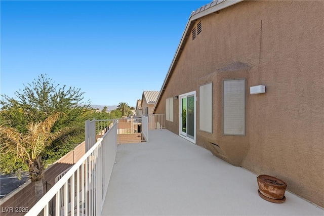 283 Grand Olympia Dr, Henderson, NV 89012 - view of side of property featuring stucco siding and a balcony