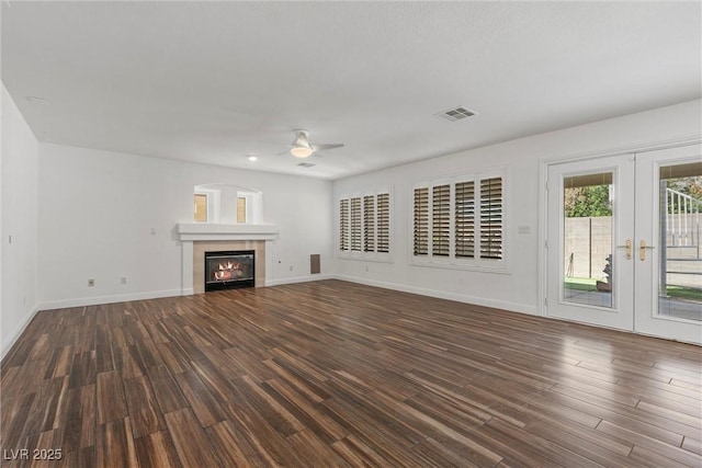 283 Grand Olympia Dr, Henderson, NV 89012 - unfurnished living room with ceiling fan, wood finished floors, french doors, and baseboards