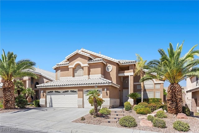 283 Grand Olympia Dr, Henderson, NV 89012 - view of front of house featuring stucco siding, driveway, an attached garage, and a tiled roof