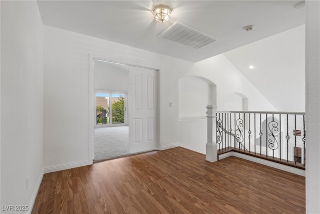 283 Grand Olympia Dr, Henderson, NV 89012 - entryway with wood finished floors, arched walkways, and baseboards