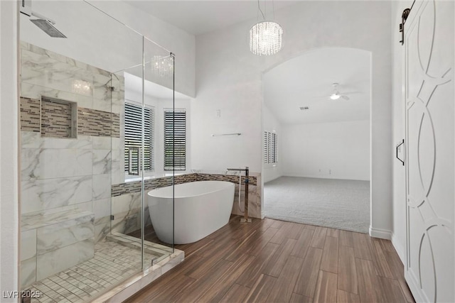 283 Grand Olympia Dr, Henderson, NV 89012 - full bathroom featuring a marble finish shower, a freestanding tub, wood finished floors, and ceiling fan