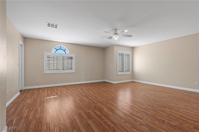 283 Grand Olympia Dr, Henderson, NV 89012 - spare room featuring wood finished floors, ceiling fan, and baseboards