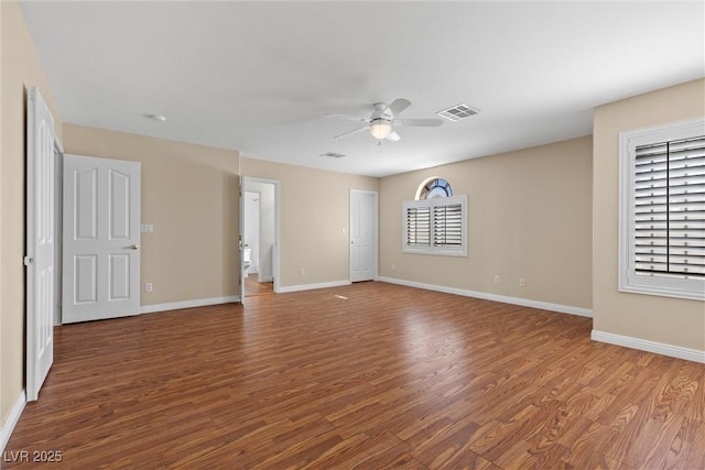 283 Grand Olympia Dr, Henderson, NV 89012 - spare room with wood finished floors, a ceiling fan, and baseboards