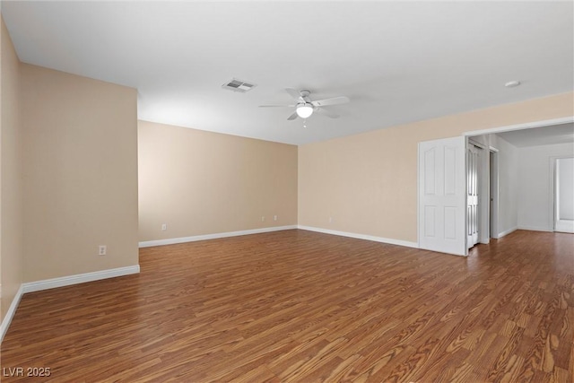 283 Grand Olympia Dr, Henderson, NV 89012 - unfurnished room featuring a ceiling fan, wood finished floors, and baseboards