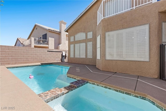 283 Grand Olympia Dr, Henderson, NV 89012 - view of pool featuring a pool with connected hot tub, a patio area, and fence