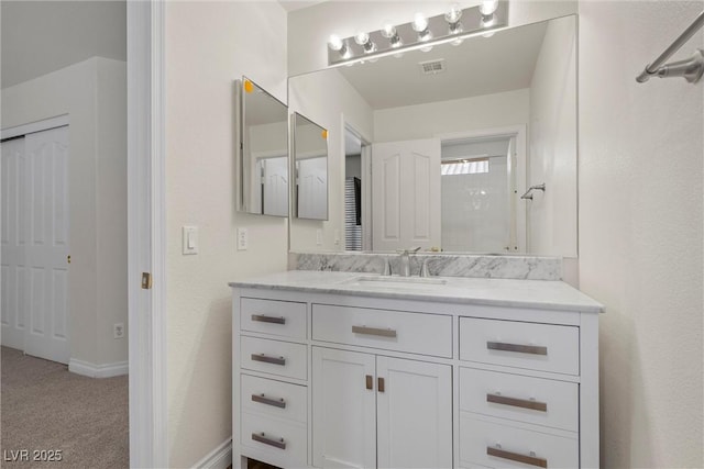 283 Grand Olympia Dr, Henderson, NV 89012 - bathroom featuring vanity and baseboards