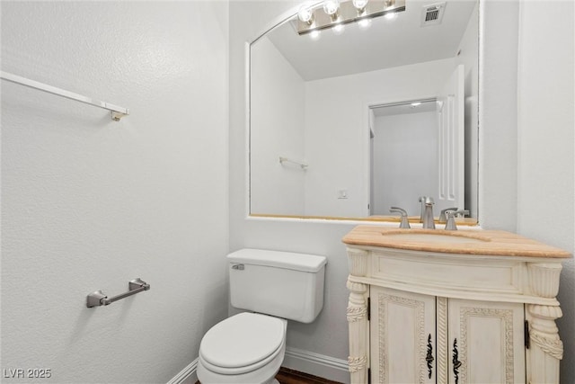 283 Grand Olympia Dr, Henderson, NV 89012 - half bath with toilet, vanity, and baseboards