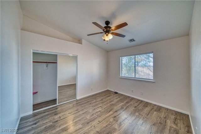 151 Hornet St, Pahrump, NV 89048 - unfurnished bedroom with vaulted ceiling, wood finished floors, baseboards, a closet, and ceiling fan