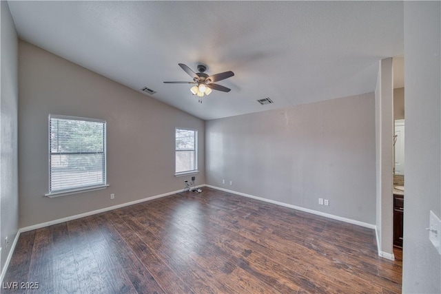 151 Hornet St, Pahrump, NV 89048 - unfurnished room featuring dark wood finished floors, ceiling fan, lofted ceiling, and baseboards