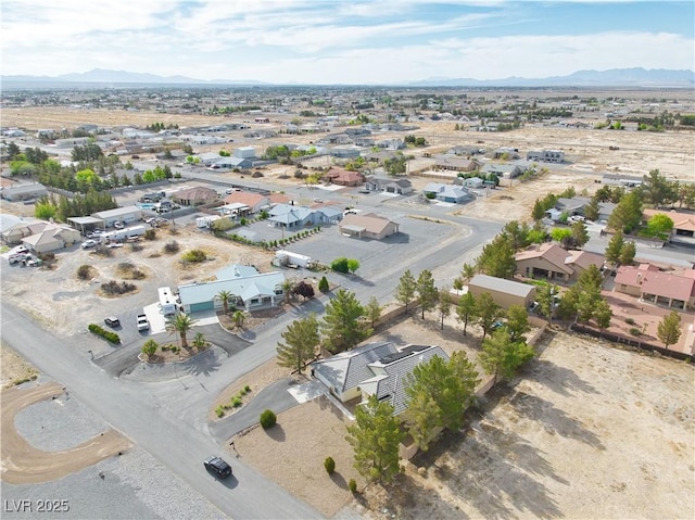 151 Hornet St, Pahrump, NV 89048 - aerial view of residential area featuring a mountain backdrop and a desert landscape