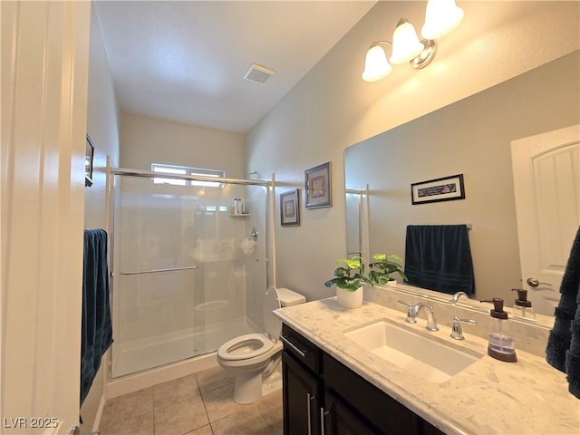 8303 Saddleback Ledge Ave, Las Vegas, NV 89147 - full bathroom featuring toilet, a stall shower, tile patterned flooring, and vanity