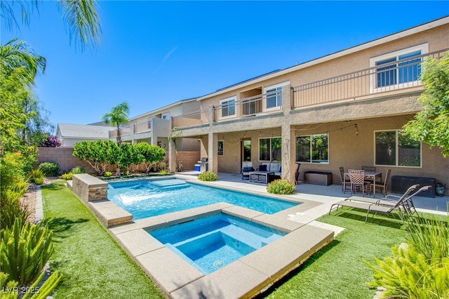 8303 Saddleback Ledge Ave, Las Vegas, NV 89147 - view of pool featuring an in-ground hot tub, a patio area, and an outdoor hangout area