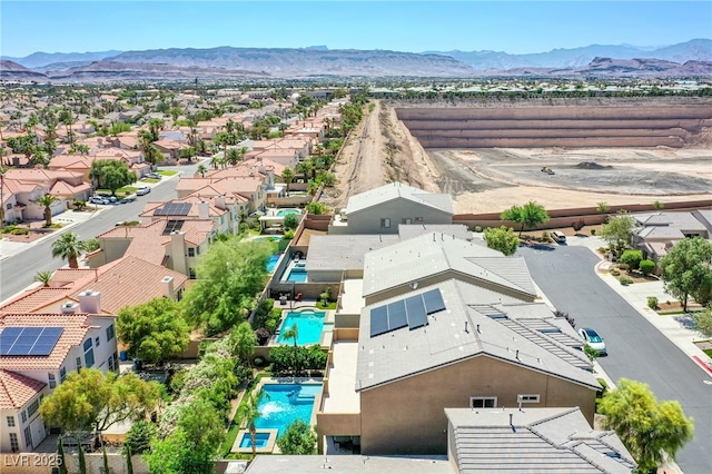 8303 Saddleback Ledge Ave, Las Vegas, NV 89147 - aerial view of residential area featuring a mountainous background