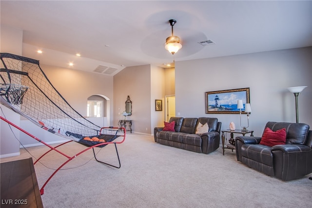 8303 Saddleback Ledge Ave, Las Vegas, NV 89147 - carpeted living room featuring arched walkways, vaulted ceiling, a ceiling fan, and recessed lighting