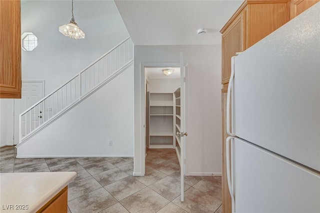 interior space with baseboards and tile patterned flooring