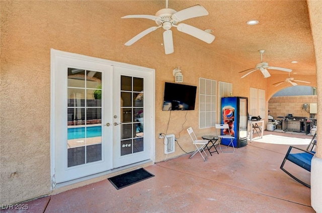 view of patio featuring ceiling fan and french doors
