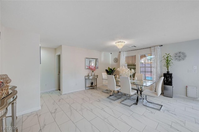 dining room featuring visible vents, marble finish floor, and baseboards