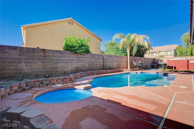 view of pool with a fenced in pool, a patio, a fenced backyard, and an in ground hot tub