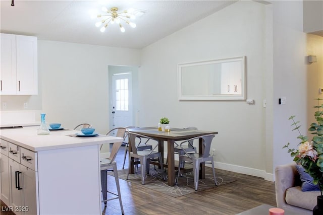 6198 Pinewood Ave, Las Vegas, NV 89103 - dining space featuring baseboards, wood finished floors, a notable chandelier, and vaulted ceiling