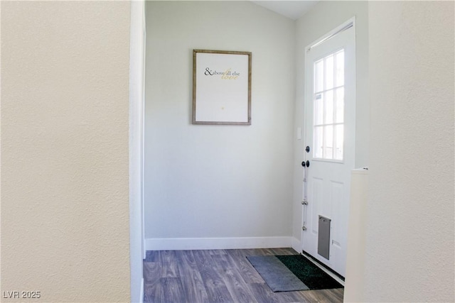 6198 Pinewood Ave, Las Vegas, NV 89103 - doorway featuring baseboards and dark wood finished floors